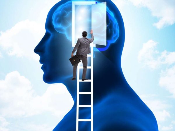 A silhouette of a man with another figure climbing a ladder into his head, symbolising introspection and the exploration of emotions