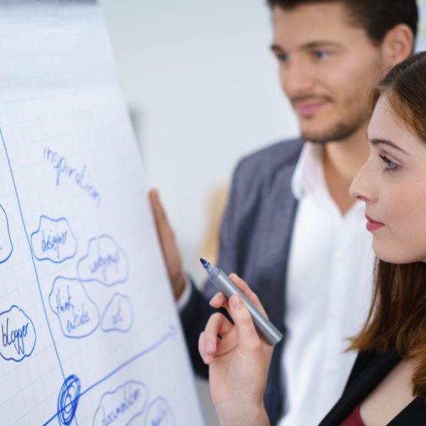A group of diverse individuals collaborating in a modern workspace, symbolising teamwork and career readiness.